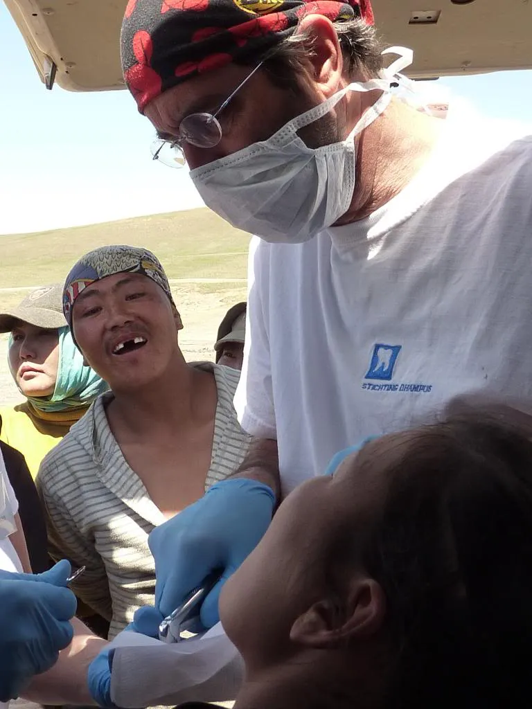 Dentist Joost van Vlijmen treating a patient
